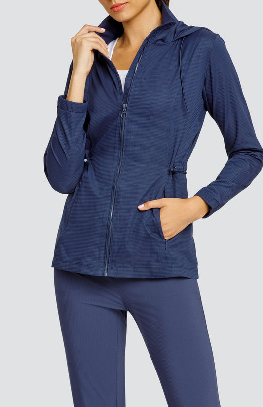 Model is wearing a Navy Blue, water-resistant hooded jacket.