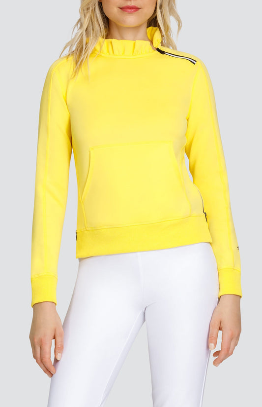 Model is wearing bright Yellow pullover with side zipper at the collar and kangaroo pocket. Paired with Chalk Mulligan Capris. 