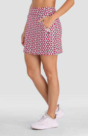 Model wearing a pull-on skort with a geometric red and white print.