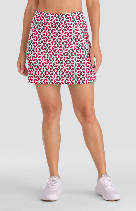 Model wearing a pull-on skort with a geometric red and white print.