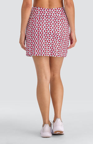 Model wearing a pull-on skort with a geometric red and white print.