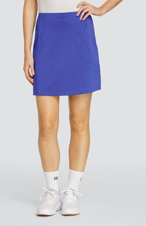 Model wearing a solid blue pull-on golf skort.