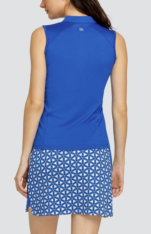Model wearing a solid blue sleeveless top and a skort with a blue and white lattice pattern.