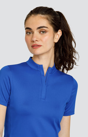 Model wearing a short sleeve solid blue top.