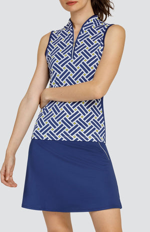 Model is wearing a sleeveless performance jersey top with a Mandarin styled collar. Top is in "Electric Diamond" print, combining Lakestorm blue, Dandelion yellow, and Chalk white. 